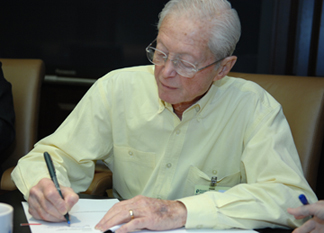 Ralph Rosenberg, Chairman of the Hospital Authority of Albany/Dougherty County Signs Documents for Transition